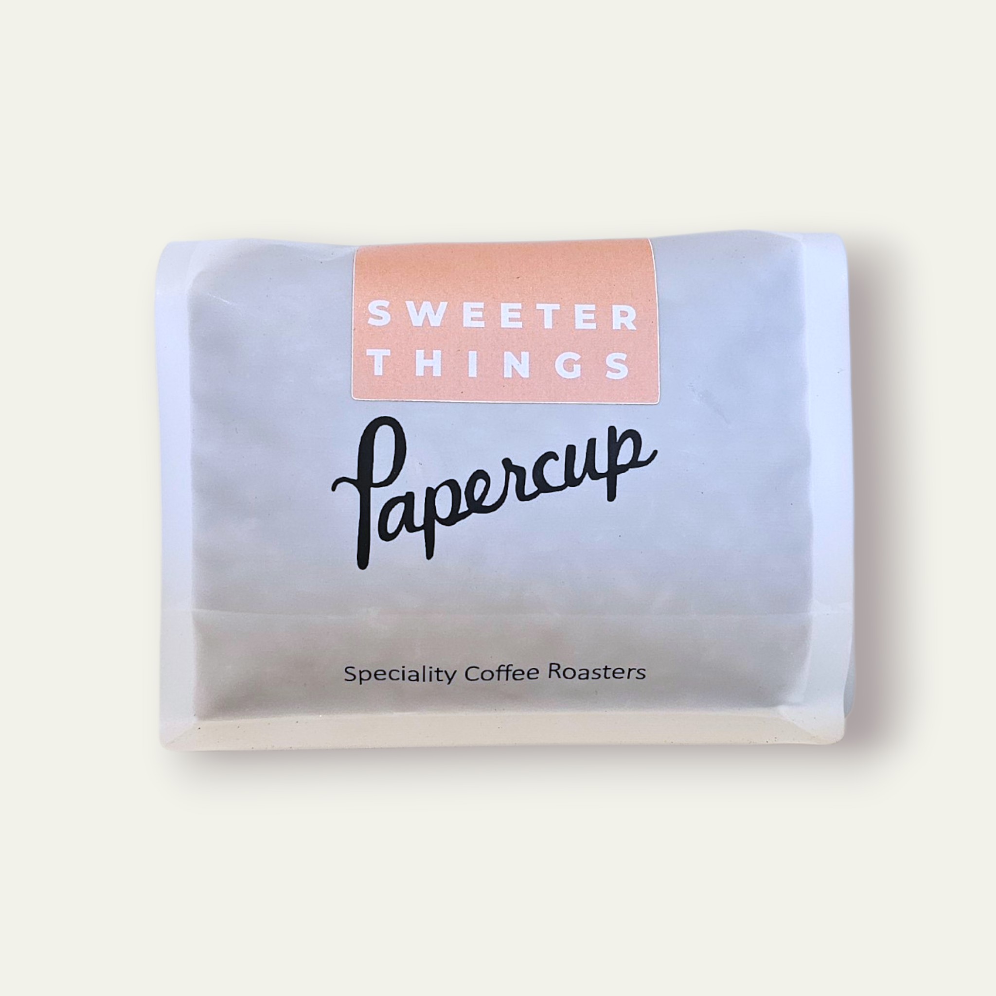 Sweeter Things - Colombia. White branded Papercup bag with a pale orange sweeter things label.